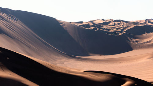 Scenic view of desert against clear sky