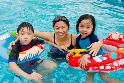 Portrait of family in swimming pool