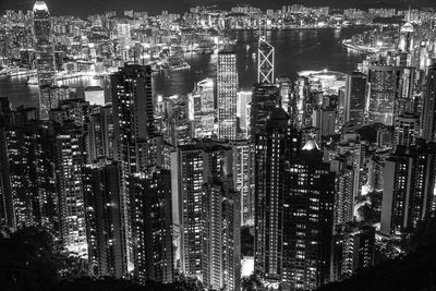 High angle view of illuminated buildings in city at night