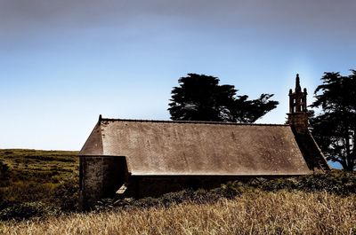 Built structure on field against clear sky