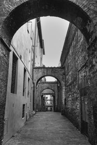 Empty alley amidst buildings