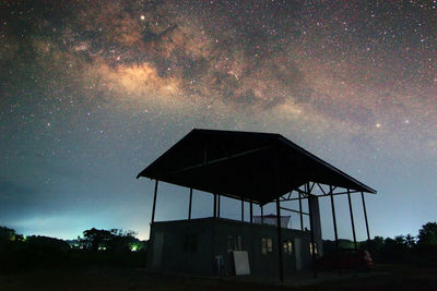 Low angle view of built structure against sky at night