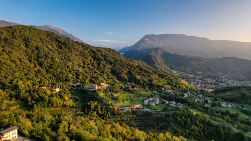 High angle view of townscape and mountains against sky