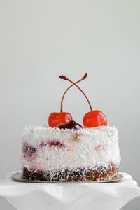 Close-up of cake against white background