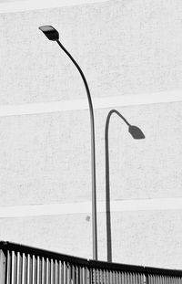 Street light in city against wall