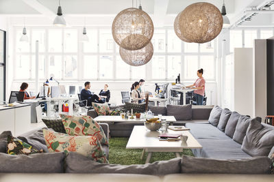 Modern office lobby with business people working in background