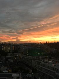 Cityscape against sky during sunset