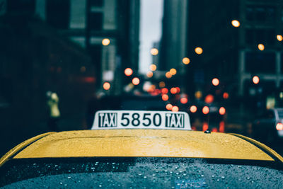 Taxi on street during rainy season