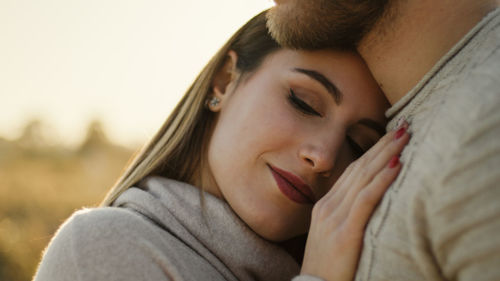 Couple of italian girl and boy hug each other intensely