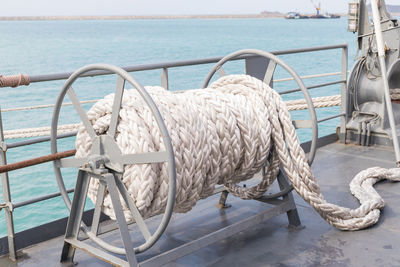 Nautical vessel on swimming pool by sea against sky