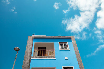 Low angle view of building against blue sky