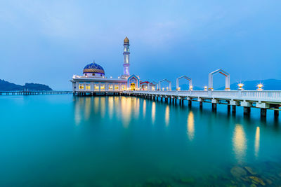 View of illuminated bridge against blue sky