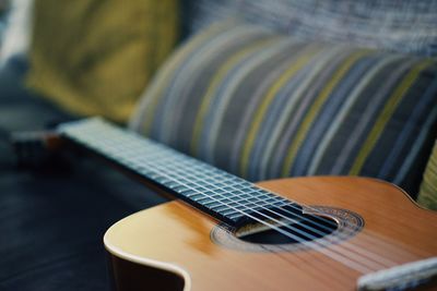 Close-up of guitar on table