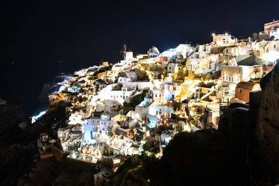 High angle shot of townscape against sky at night