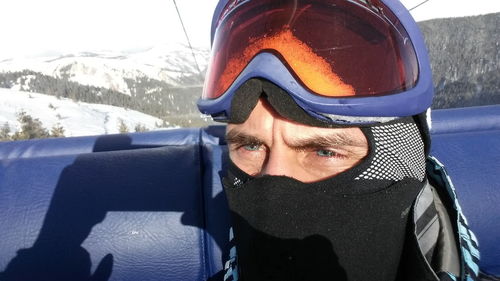 Portrait of mid adult man in snow