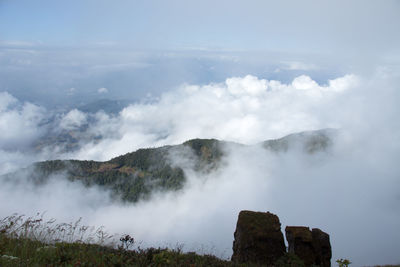 Scenic view of waterfall against sky