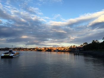 Scenic view of sea against sky in city