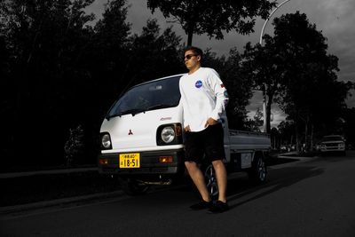 Man standing in car