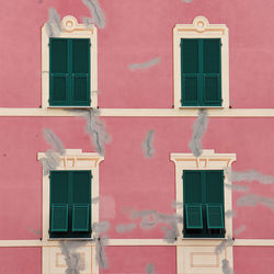 Pink house and four windows