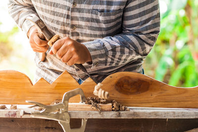 Midsection of man preparing food on table