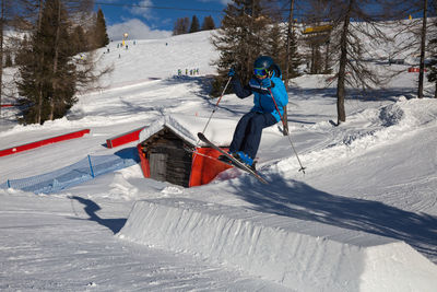 Person skiing on snow covered field