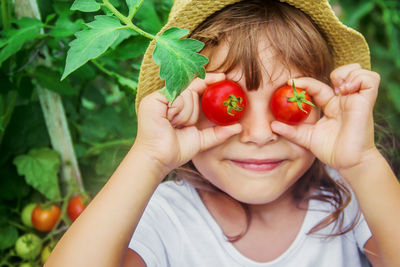 Close-up of woman holding vegetables