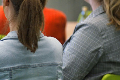 Rear view of two people at home
