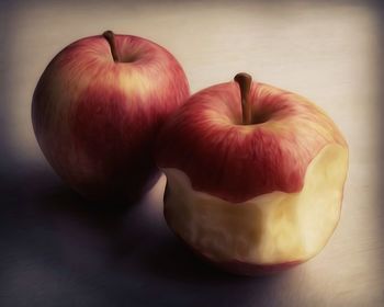 Close-up of apple over white background