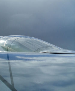 Airplane flying against sky