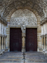 Statue in front of historic building