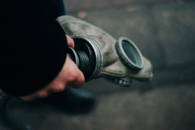 High angle view of person holding camera