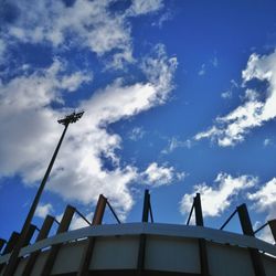 Low angle view of building against cloudy sky