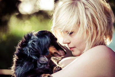 Close-up of woman with dog