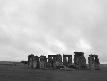 Ruins of castle against cloudy sky