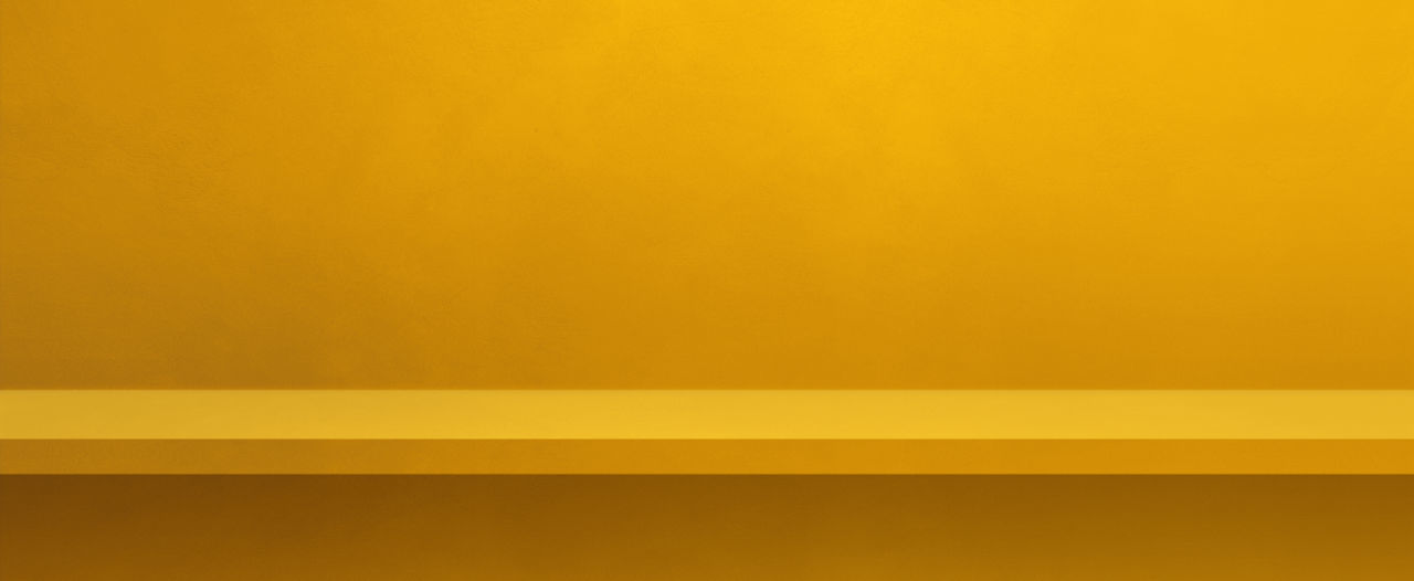 FULL FRAME SHOT OF YELLOW WALL WITH ORANGE BACKGROUND