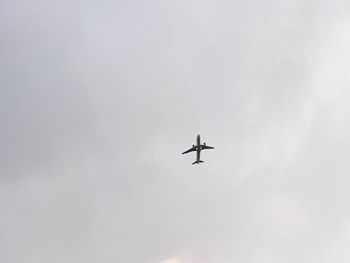 Low angle view of airplane in sky