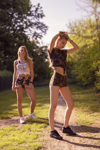 Friends standing on field at park