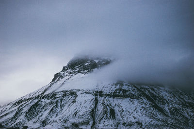 Low angle view of snow covered mountain