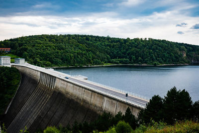 View of dam and river against sky