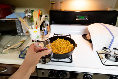 Hand of person having food at home