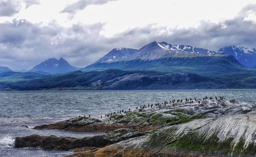 Scenic view of mountains against cloudy sky