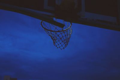 Low angle view of basketball hoop against blue sky