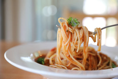 Close-up of noodles in plate on table