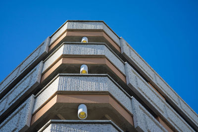 Low angle view of historic building against clear blue sky