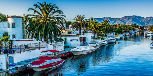 Calm sea with buildings in background