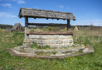 Medieval draw well in sunny ambiance at early spring time