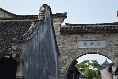 Low angle view of old building against sky