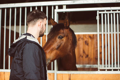 Man standing in stable