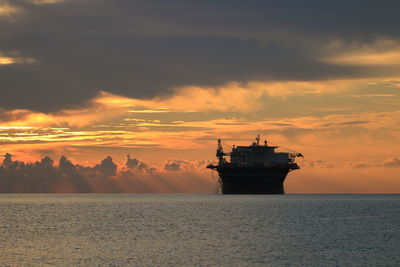 Scenic view of sea against sky during sunrise 