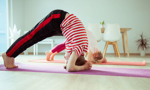 Cute girl exercising at home